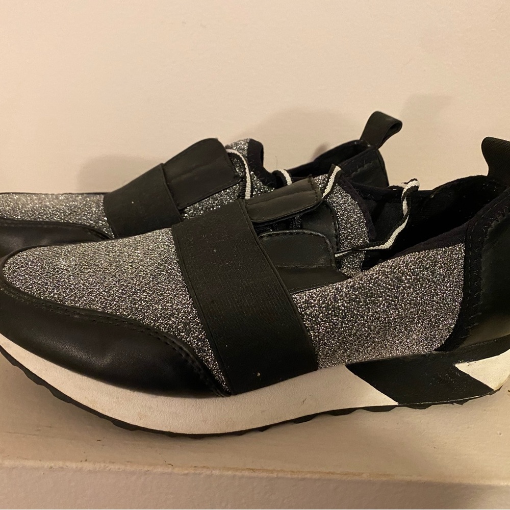 Black and silver Brash sneakers. Good condition, they weren’t worn much.